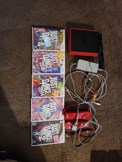 Red Nintendo Wii Mini with games