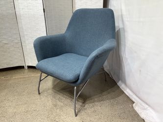 Lounge Chair in Old Blue Jeans with Curved Arms And Steel Legs
