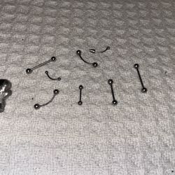 Silver Piercings And Globe Emblem 