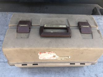 Tan colored plastic tackle box, loaded!