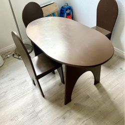 Kids table with 3 chairs for snacks, artwork, board/card games & homework