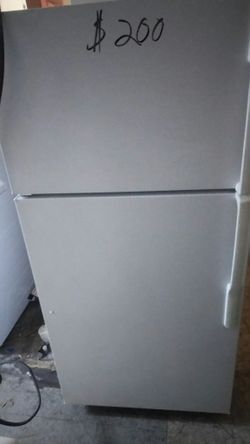 Apt size GE refrigerator.