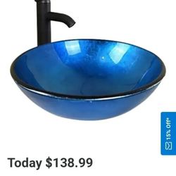 Bathroom blue glass sink oil mill bronze faucet and pop-up drain pipe...