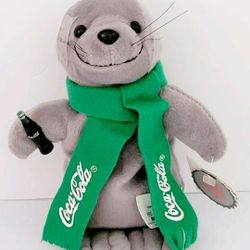 New W/Tags Vintage 1998 COCA-COLA Seal Plush W/Coke Bottle & Green Scarf Stuffed Animal. For sale is a vintage 1998 Coca-Cola Seal plush stuffed anima