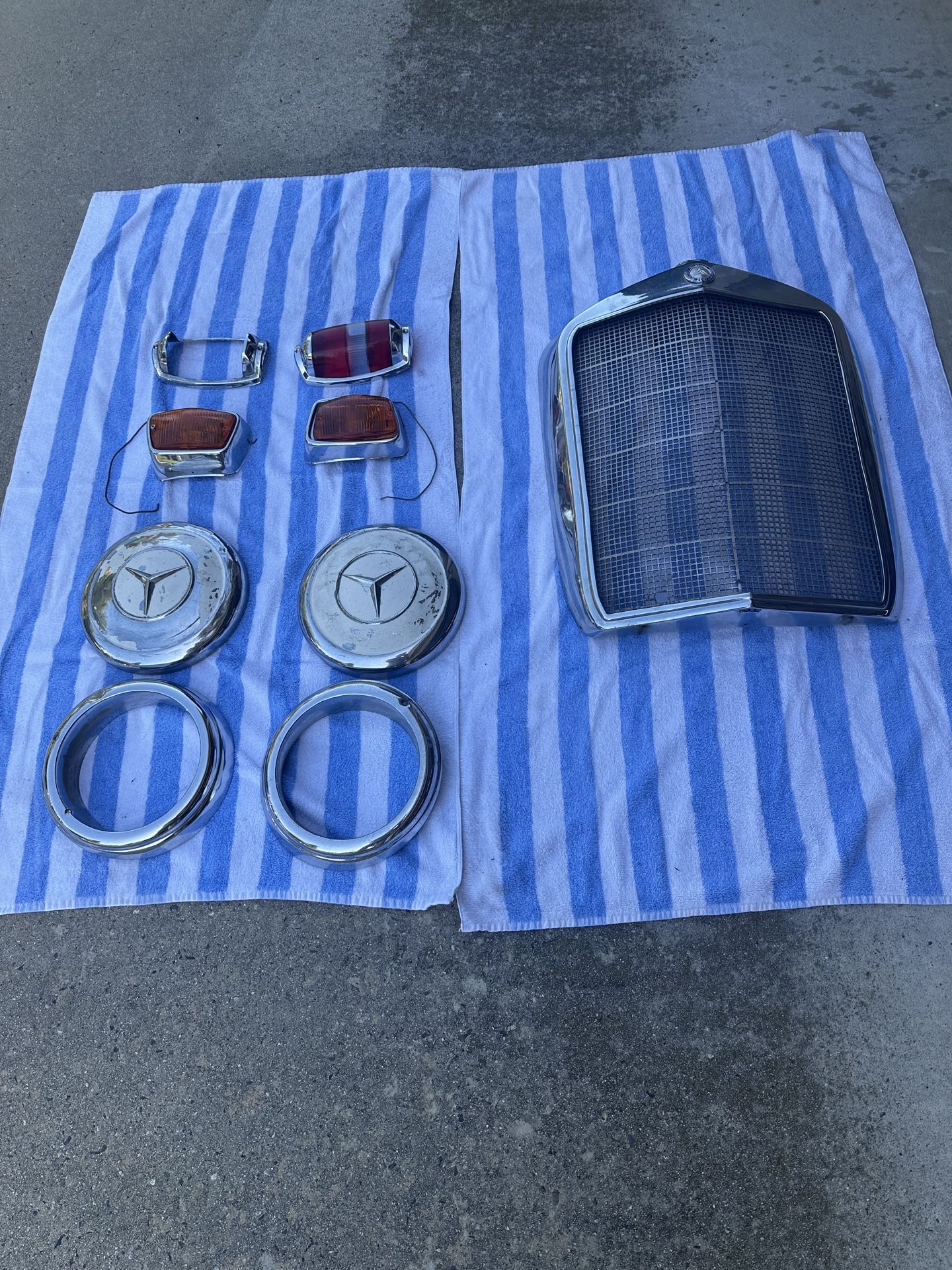 Early 1960s Mercedes Benz Grille, Hubcaps, & Front and Rear Light Assemblies