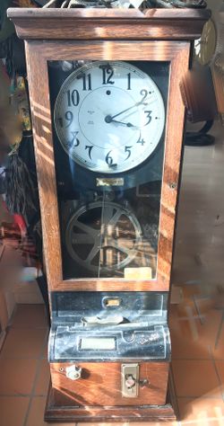 Antique Simplex time clock has been electrified. Solid beautiful oak case original glass that shows that glass is always liquid.