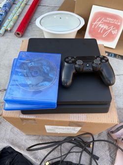 PS4 with controller and 3 games