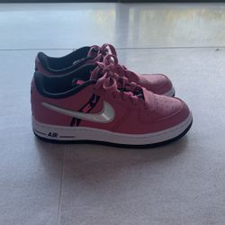 pink nike airforces with a silver holographic check