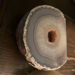 This is a natural agate geode slice from Brazil featuring polished quartz