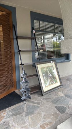 Buy all we did not sell for $150 for table, ladder shelf, frame palm frond, lamp, more