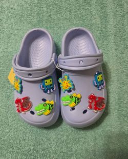 Light Blue Clogs with Dinosaur Charms size 9