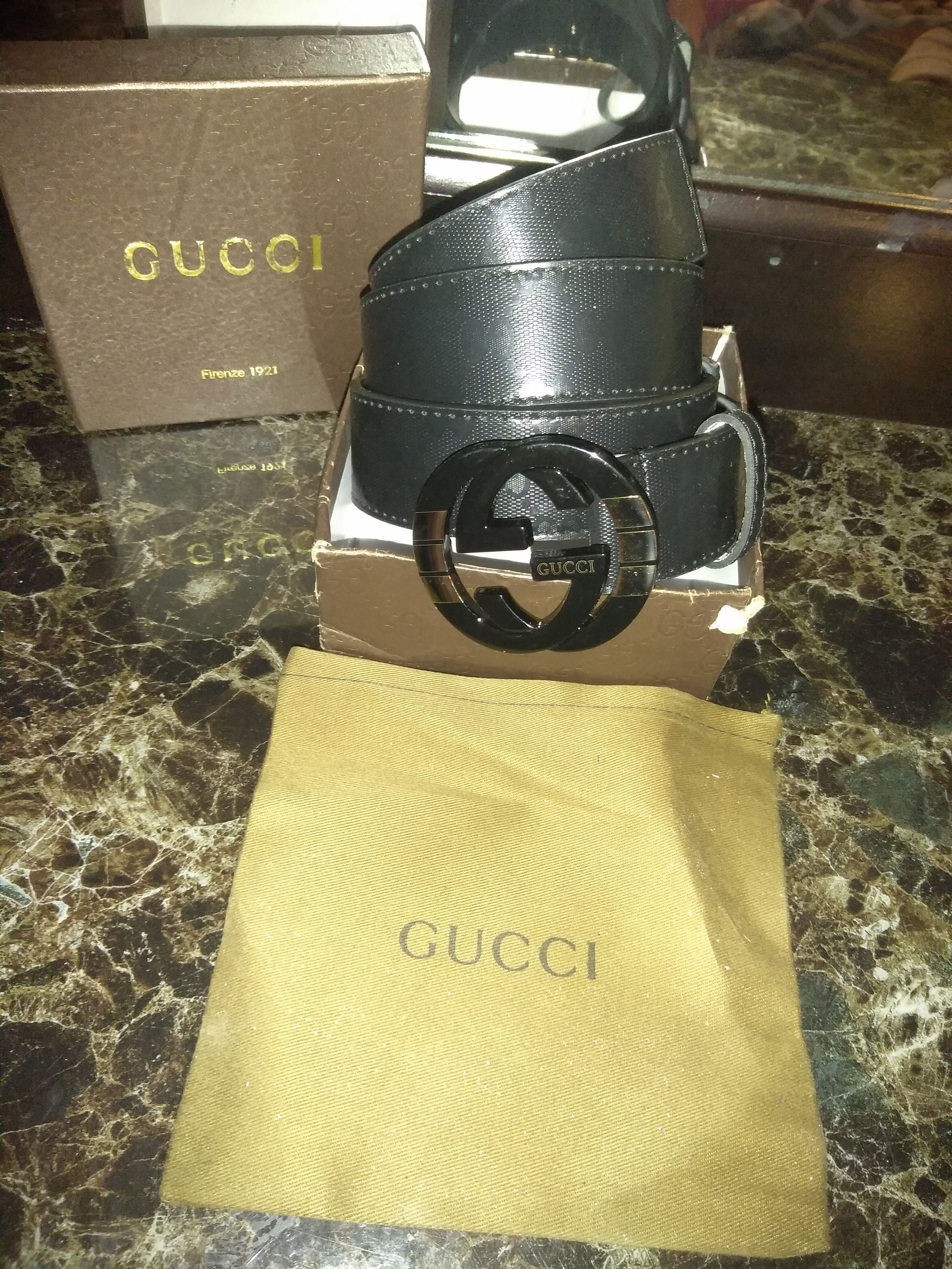 Black Gucci with black an gold buckle