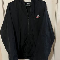 Nike black windbreaker jacket with hood and pockets