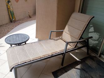 Lounge chair adjustable back. Metal base beige seating 10.00
