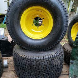 Pair of 26.5x14.00-12 Kenda K507 Turf Lawnmower Tires on a JD yellow 6-lug wheel
