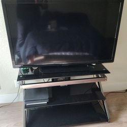 Emerson 65 inch Tv with Tv stand