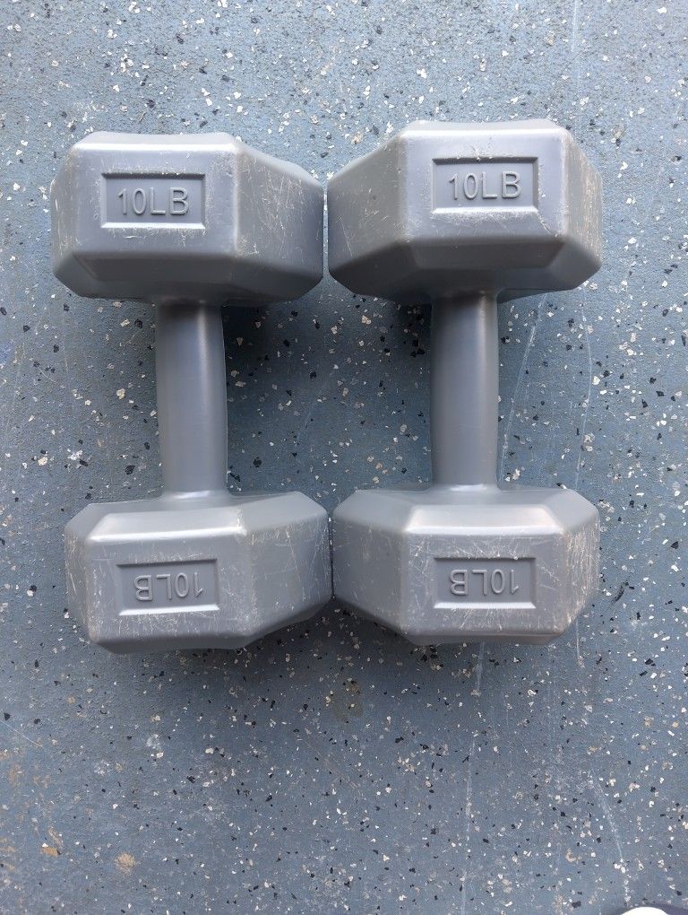 TWO 10 POUND PLASTIC DUMBBELLS.