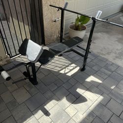 Workout bench with barbell