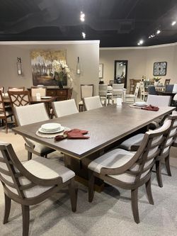 Versatile style dining sets w/unique base starts at $995.00