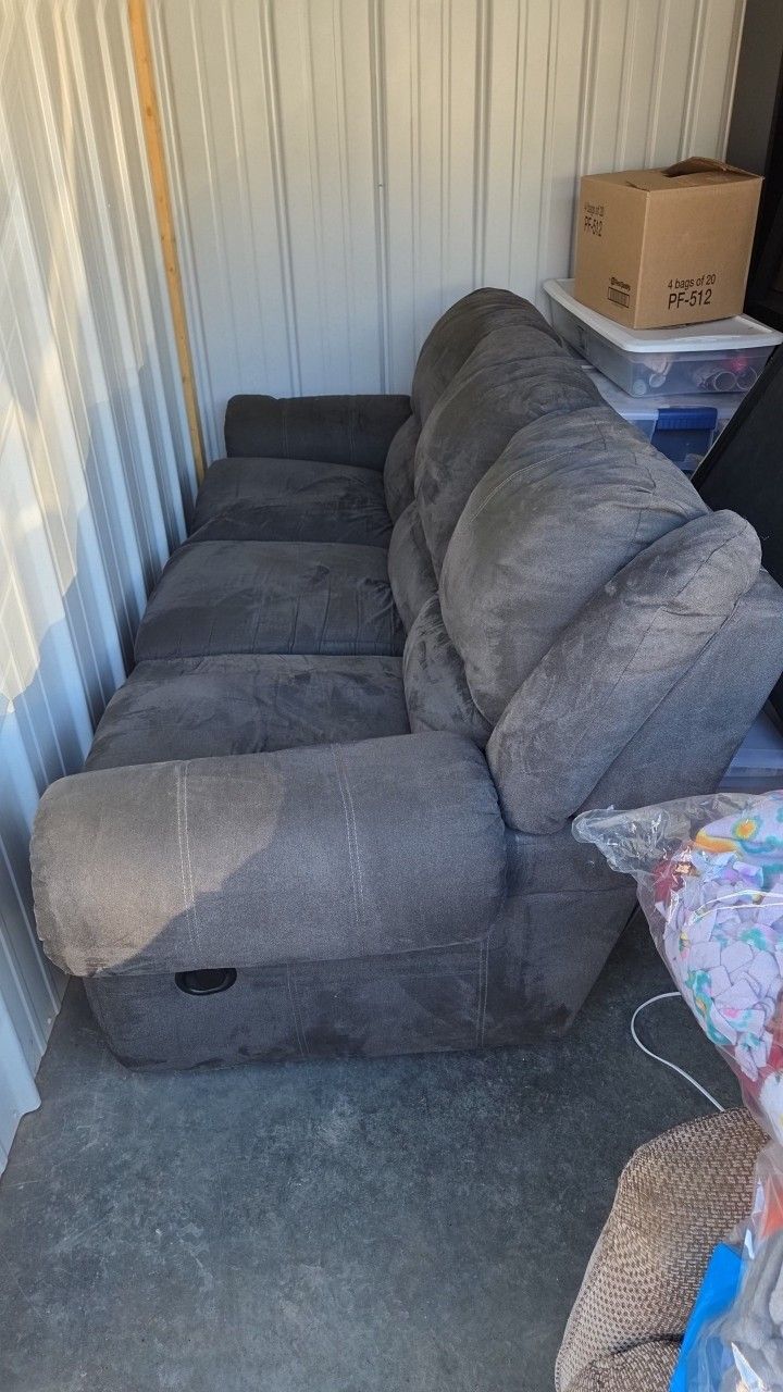 Gray Reclinering Couch On Both Ends . 