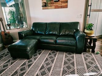 Leather couch and Chair with Ottoman and rug