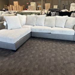Cream And Grey Leather Sectional With Pillows