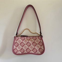 Guess Beacon Falls mini crossbody bag in a pink monogram print