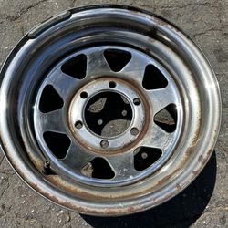One 14x7 chrome wagon wheel style rim from a 6 lug pickup