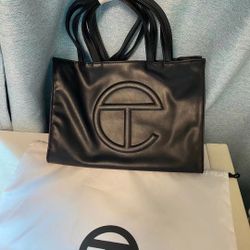  Telfar black Shoppe medium 			
