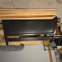 King Size Bed Frame with Leather Headboard.  Dark Wood. In Very Good Shape. 