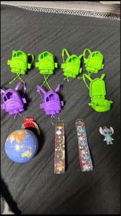 7 Toy Story backpacks (empty) they do open. One new globe, two beauty and the beast keychains and a little stitch keychain $5 for all