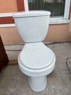 Toilet in good condition and very clean; works well. It measures 15 1/2 inches in height.