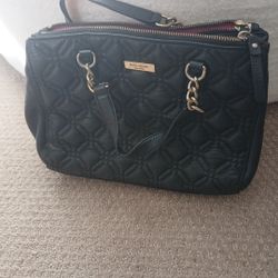 2 Kate Spade Purses,one Is black the other is dark red.both are Kate spade NewYork.