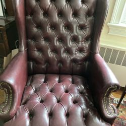 Leather wing back chair and ottoman great condition maroon