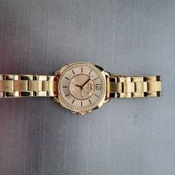 Coach gold and diamond watch paid $495