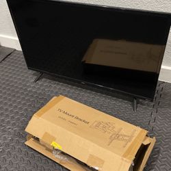 Like New - TCL 32” Roku TV & Wall mount 