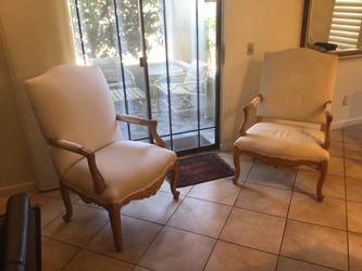 Two hand carved and upholstered arm chairs in good condition. Buy one for $150 or buy both for $250.
