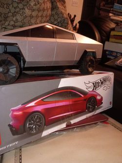 Tesla truck and Tesla red roadster