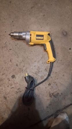 heavy-duty corded electric drill, specifically the DeWalt DW235G 1/2-Inch Variable Speed Reversing (VSR) Drill, featuring a 7.8-amp motor and a metal 