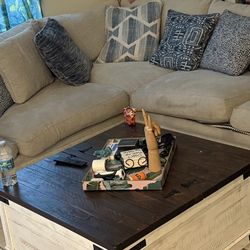 Sectional couch with goose feather cushions.