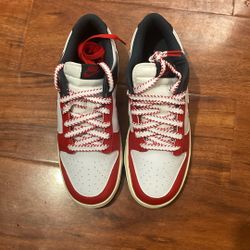 This is a Nike Dunk Low Retro "Boston Red Sox" sneaker in a white, university red, and thunder blue colorway. 