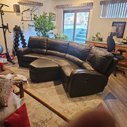 Curved leather sofa recliner