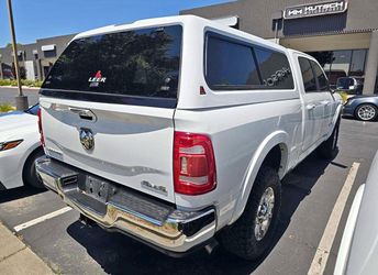 2019–2026 RAM 2500 or 3500 6ft 4 bed with this quality pre-owned LEER camper shell!
