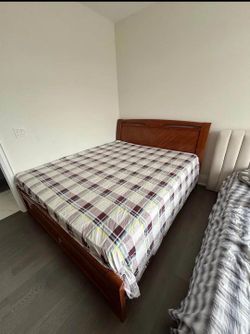 Wooden queen bed frame with mattress