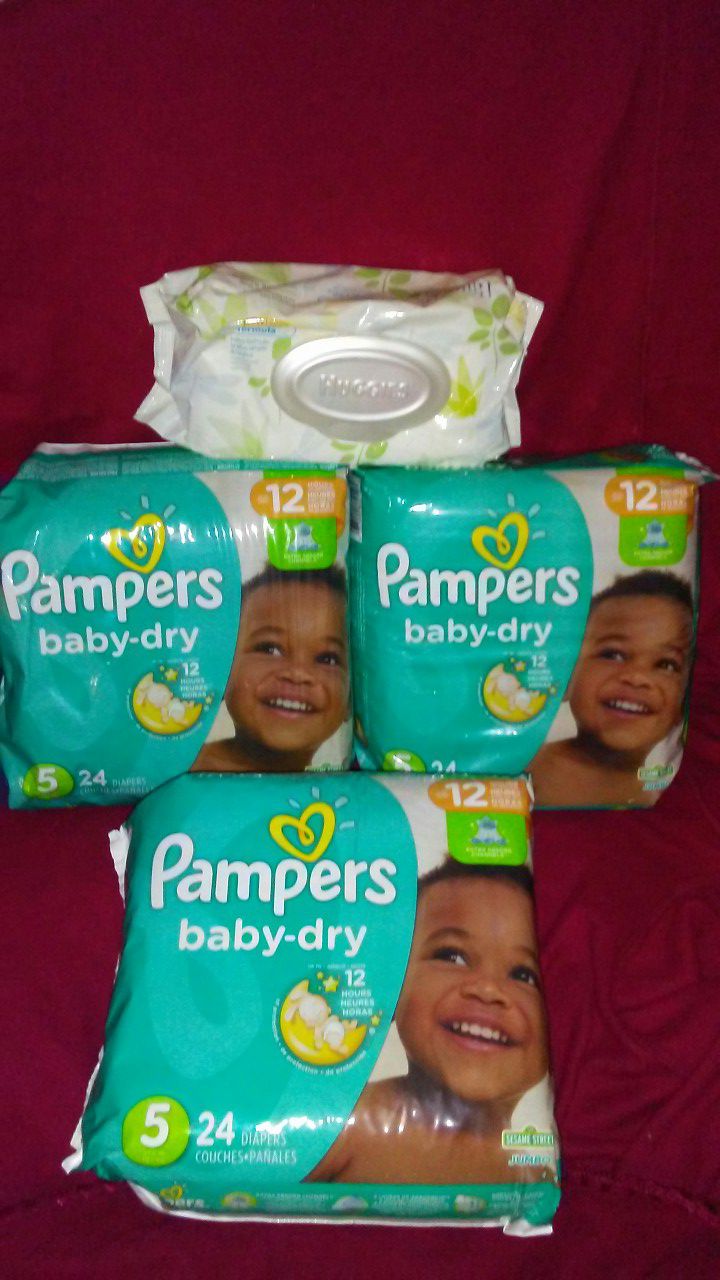 3 packs of pampers sz 5 plus a pack of wipes