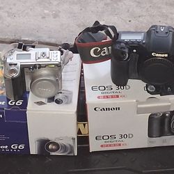 2 Canon Digital Camera  With Batteries And Charger 
