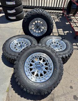 🔥17x8.5 KMC CRUX WHEELS KM556 GLOSS SILVER RIMS + 285/70R17 TIRES 6 LUG CHEVY GMC FORD SILVERADO RAPTOR F150