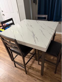Kitchen table and four chairs. Read description
