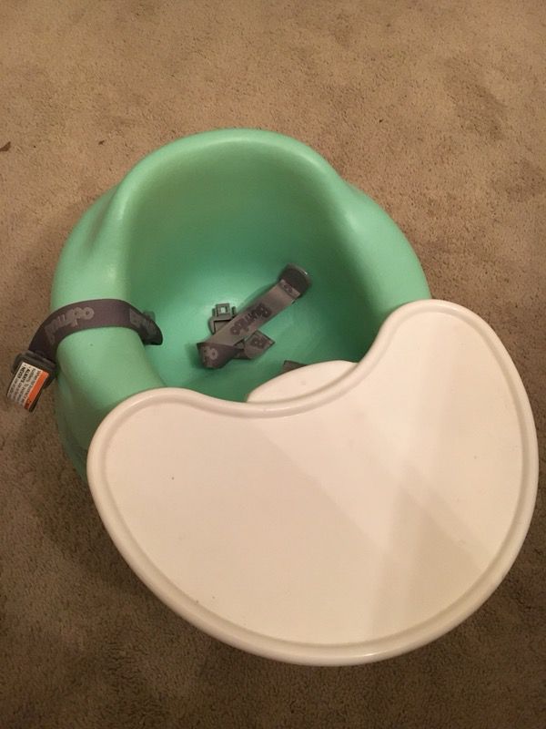 Green Bumbo seat with play tray