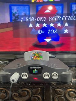 Selling an N64 with cables and controller; game not included—it's just to show that it works.
